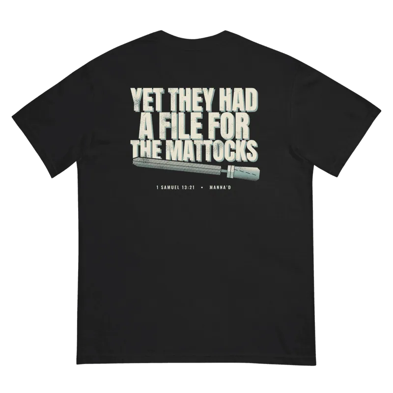 Back of a black Manna’d tee printed: YET THEY HAD A FILE FOR THE MATTOCKS (1 Sam 13:21)