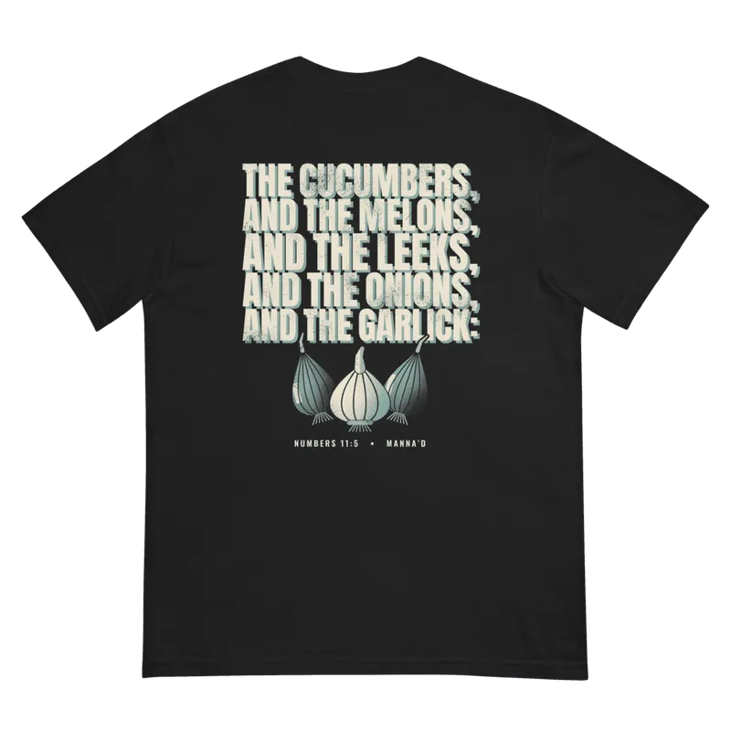 Back of a black Manna’d tee printed: THE CUCUMBERS, AND THE MELONS, AND THE LEEKS, AND THE ONIONS, AND THE GARLICK: (Num 11:5)
