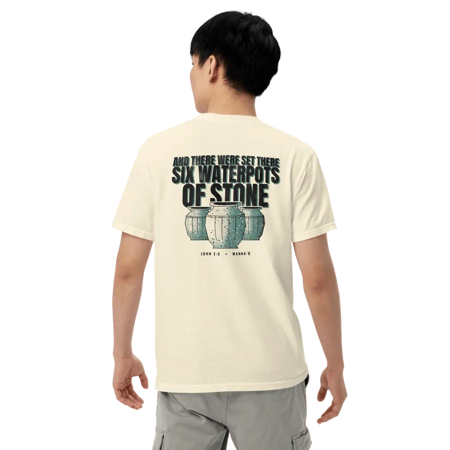 Model wearing the bone Manna’d tee, back printed AND THERE WERE SET THERE SIX WATERPOTS OF STONE (John 2:6)